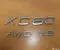 Volvo XC60 2010 Insigne/emblème - Image 1